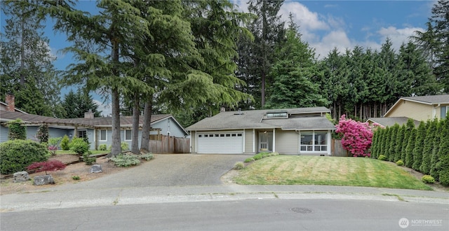 view of front of home featuring a garage and driveway