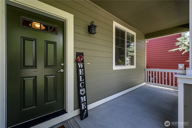 doorway to property featuring a porch