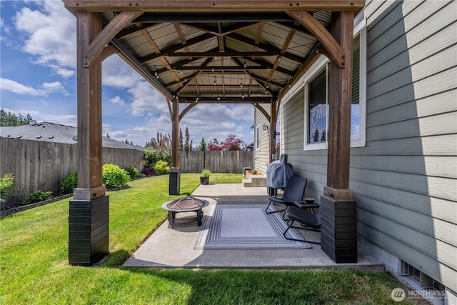 view of patio / terrace with an outdoor fire pit and a gazebo