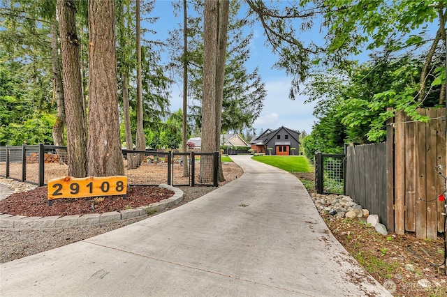 29108 218th Pl SE, Black Diamond, WA 98010 - view of concrete driveway featuring a gated entry