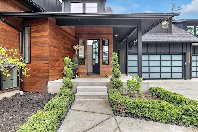 29108 218th Pl SE, Black Diamond, WA 98010 - entrance to property featuring board and batten siding, driveway, an attached garage, and a shingled roof