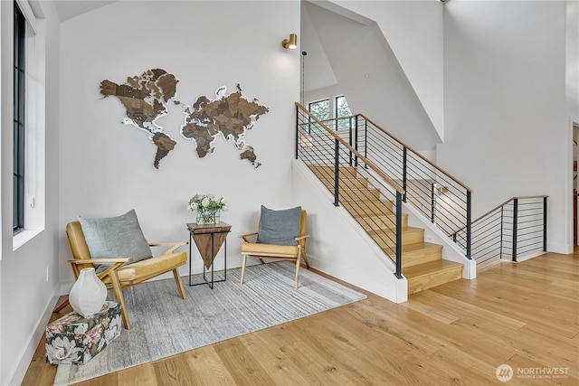 29108 218th Pl SE, Black Diamond, WA 98010 - stairs with wood finished floors, baseboards, and a towering ceiling