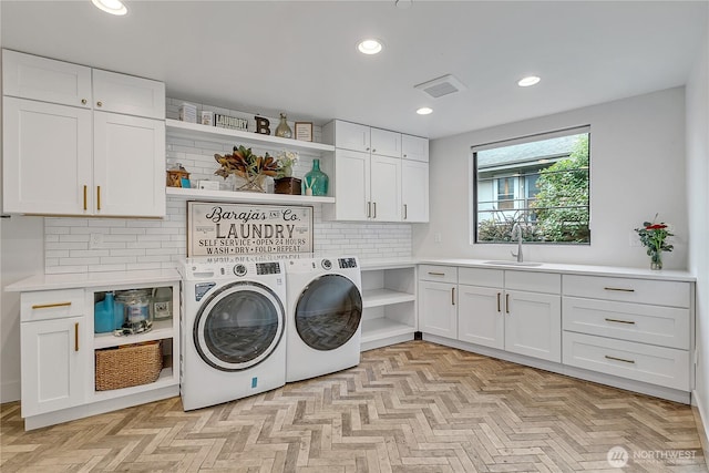 29108 218th Pl SE, Black Diamond, WA 98010 - washroom with cabinet space, washer and clothes dryer, and recessed lighting