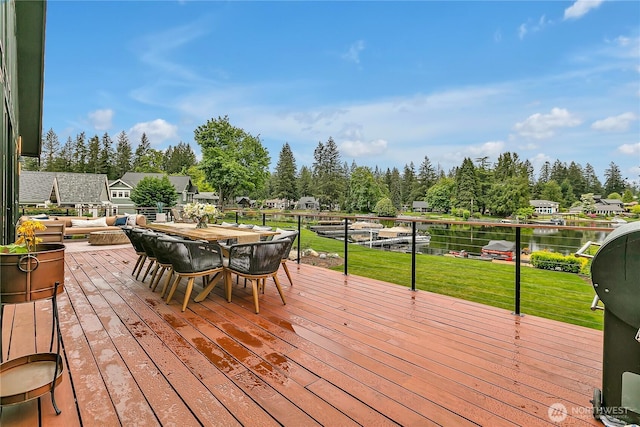 29108 218th Pl SE, Black Diamond, WA 98010 - deck with outdoor dining area, a yard, and a water view