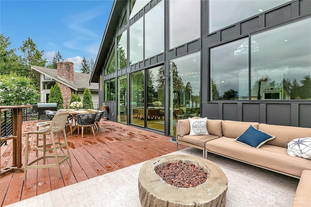29108 218th Pl SE, Black Diamond, WA 98010 - wooden deck with an outdoor living space with a fire pit, a grill, and outdoor dining space