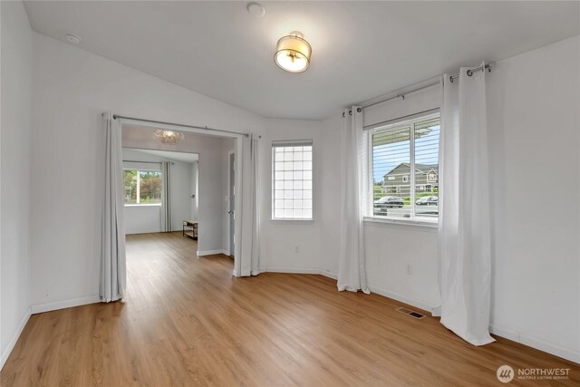 4112 Caldwell Rd E, Edgewood, WA 98372 - unfurnished room with light wood-style flooring and baseboards