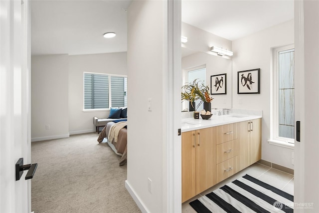 1740A NW 62nd St, Seattle, WA 98107 - bathroom featuring double vanity, baseboards, and ensuite bath