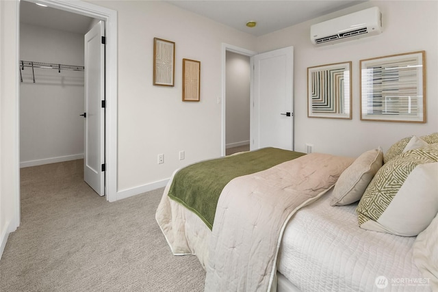 1740A NW 62nd St, Seattle, WA 98107 - carpeted bedroom featuring an AC wall unit, baseboards, and a spacious closet