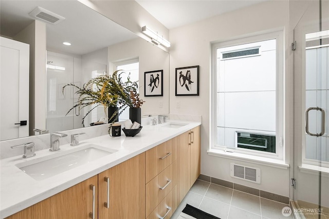 1740A NW 62nd St, Seattle, WA 98107 - full bathroom featuring double vanity, a shower stall, tile patterned flooring, and baseboards