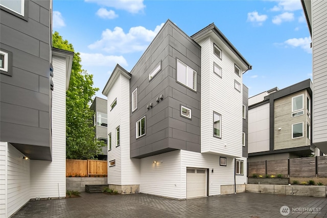 1740A NW 62nd St, Seattle, WA 98107 - view of building exterior with a garage and driveway