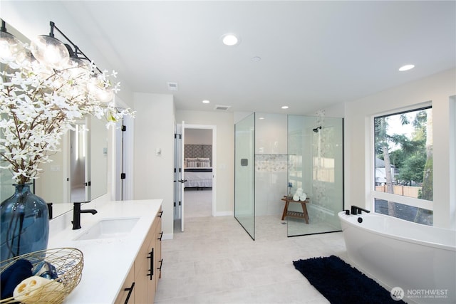 18809 94th Ave W, Edmonds, WA 98020 - full bath featuring tiled shower, a freestanding bath, vanity, recessed lighting, and baseboards