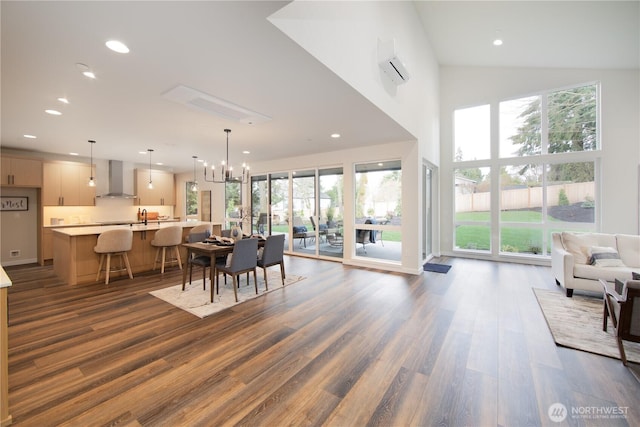 18809 94th Ave W, Edmonds, WA 98020 - dining area featuring dark wood-type flooring, healthy amount of natural light, an AC wall unit, recessed lighting, and a towering ceiling