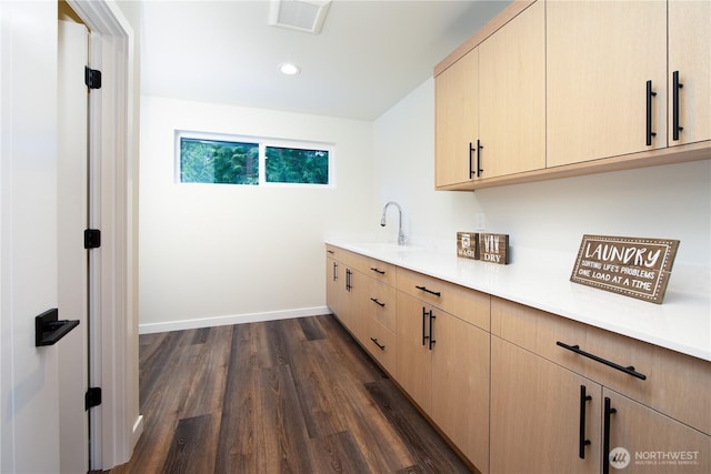 18809 94th Ave W, Edmonds, WA 98020 - laundry area featuring a sink, dark wood-type flooring, baseboards, and recessed lighting