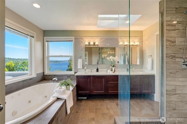 12045 Lakeside Pl NE, Seattle, WA 98125 - bathroom with vanity, a jetted tub, a shower stall, and recessed lighting