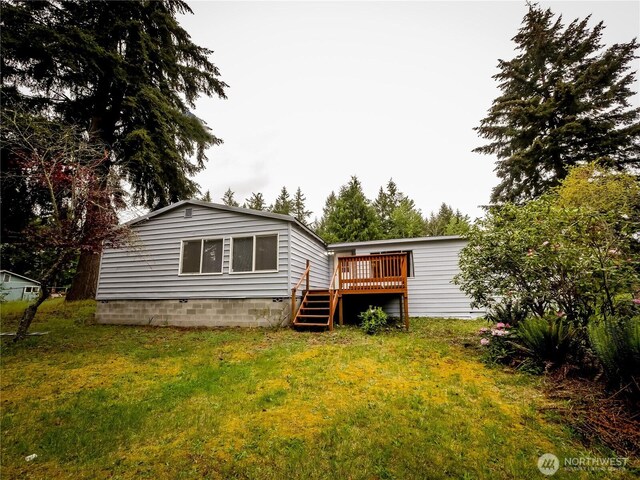 15712 123rd Ave SE, Yelm, WA 98597 - rear view of house with a deck and a yard