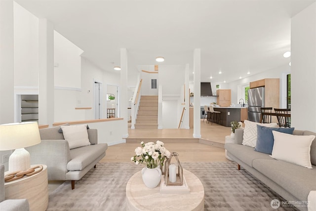 4964 Lewis Ave, Bellingham, WA 98229 - living room featuring light wood-type flooring, recessed lighting, and stairs