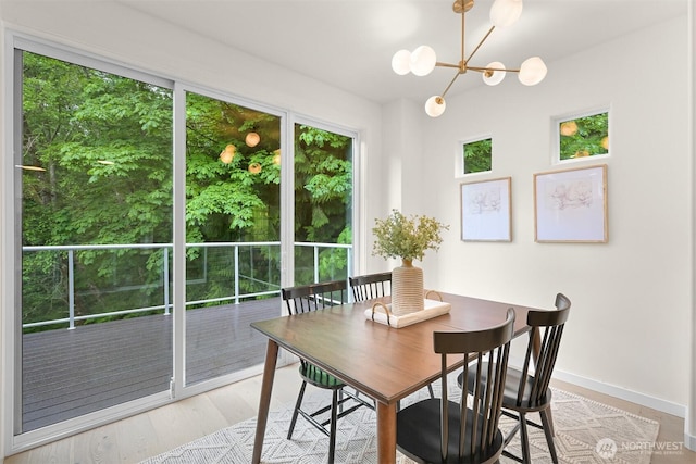 4964 Lewis Ave, Bellingham, WA 98229 - dining room featuring a chandelier, baseboards, and light wood finished floors