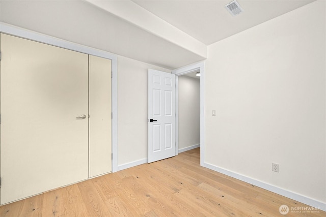 4964 Lewis Ave, Bellingham, WA 98229 - unfurnished bedroom featuring wood finished floors, baseboards, and a closet