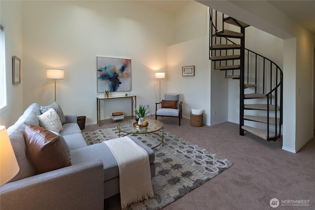 14300 32nd Ave NE Unit 402, Seattle, WA 98125 - living room with carpet flooring, a towering ceiling, stairway, and baseboards