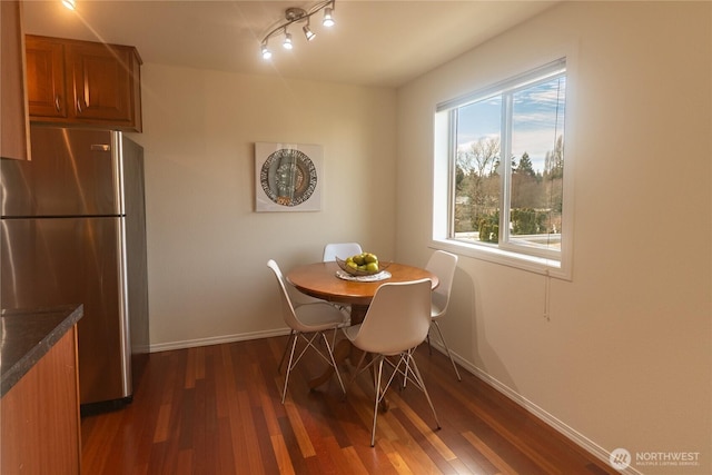 14300 32nd Ave NE Unit 402, Seattle, WA 98125 - dining area with dark wood finished floors, baseboards, and track lighting
