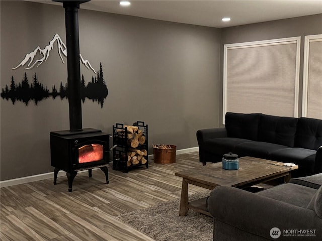 2615 Sea Crest Ave N, Long Beach, WA 98631 - living area featuring a wood stove, recessed lighting, wood finished floors, and baseboards