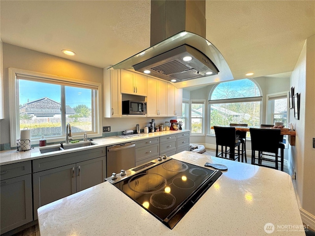 2615 Sea Crest Ave N, Long Beach, WA 98631 - kitchen with dishwasher, gray cabinetry, a sink, island range hood, and electric stove