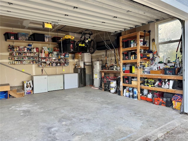 2615 Sea Crest Ave N, Long Beach, WA 98631 - garage with water heater, a workshop area, fridge, and a garage door opener