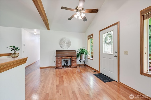 entryway with light wood finished floors, a ceiling fan, vaulted ceiling, and baseboards