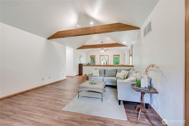 living room with wood finished floors, baseboards, and a ceiling fan
