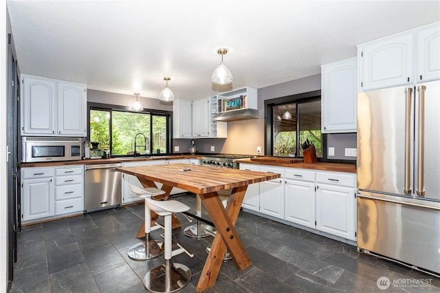 42520 State Route 2, Gold Bar, WA 98251 - kitchen with appliances with stainless steel finishes, butcher block countertops, and white cabinets