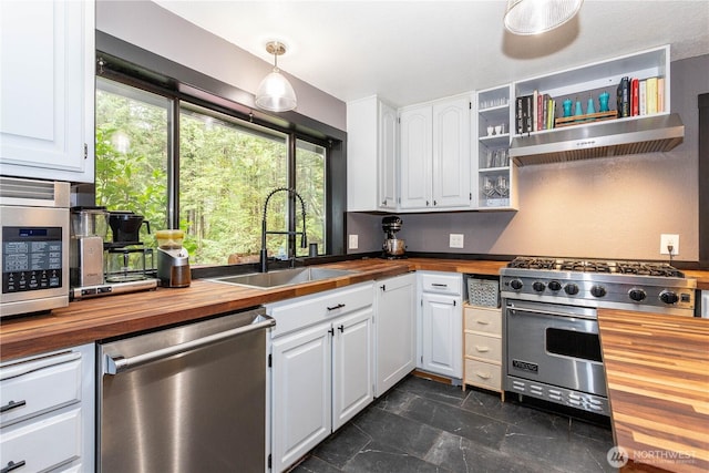 42520 State Route 2, Gold Bar, WA 98251 - kitchen with butcher block countertops, appliances with stainless steel finishes, a sink, and range hood