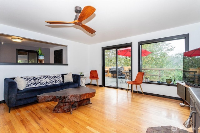 42520 State Route 2, Gold Bar, WA 98251 - living room featuring light wood-style floors, healthy amount of natural light, ceiling fan, and baseboards