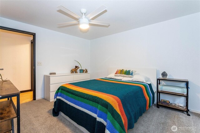 42520 State Route 2, Gold Bar, WA 98251 - bedroom with light colored carpet, a ceiling fan, and baseboards