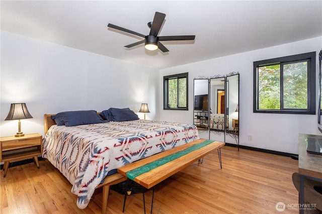 42520 State Route 2, Gold Bar, WA 98251 - bedroom featuring multiple windows, light wood-style floors, and baseboards