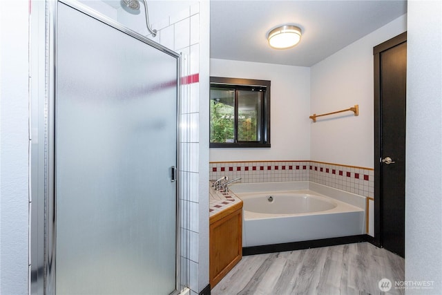 42520 State Route 2, Gold Bar, WA 98251 - bathroom with a shower stall, wood finished floors, and a bath