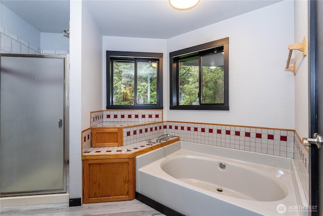 42520 State Route 2, Gold Bar, WA 98251 - bathroom featuring a shower stall, a bath, and wood finished floors