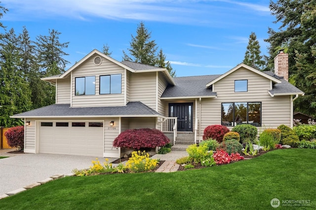 27706 NE 143rd St, Duvall, WA 98019 - tri-level home with a garage, concrete driveway, roof with shingles, a front yard, and a chimney