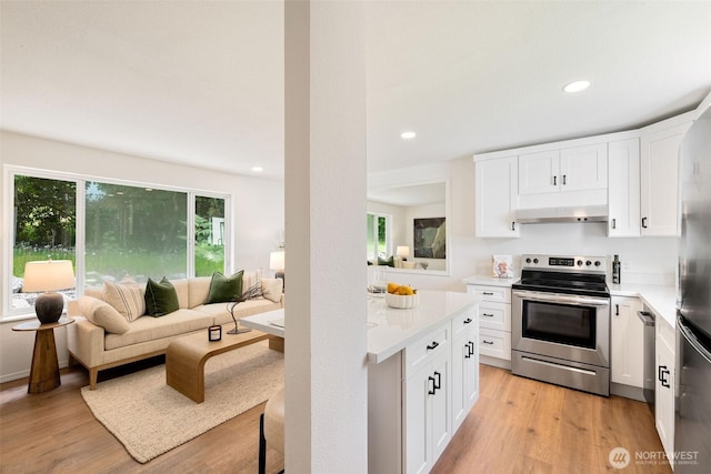 kitchen featuring stainless steel appliances, light wood-type flooring, light countertops, white cabinets, and recessed lighting
