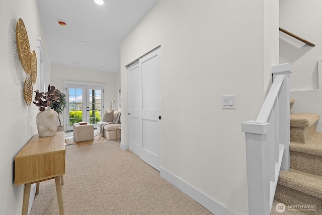 2711 10th Ave W, Seattle, WA 98119 - hall with carpet flooring, stairway, recessed lighting, french doors, and baseboards
