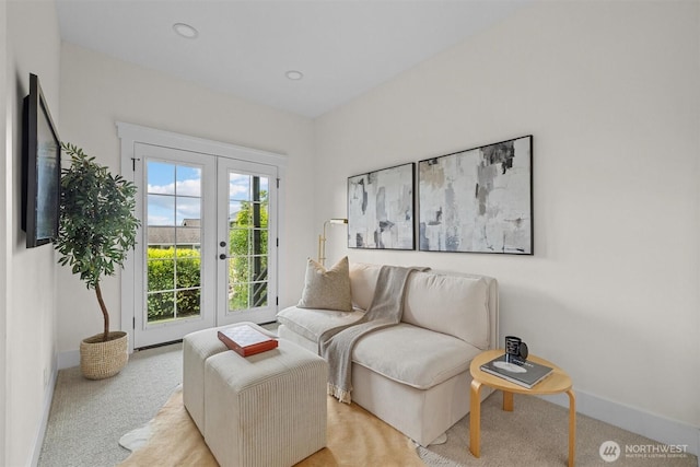 2711 10th Ave W, Seattle, WA 98119 - living area with carpet flooring, french doors, and baseboards