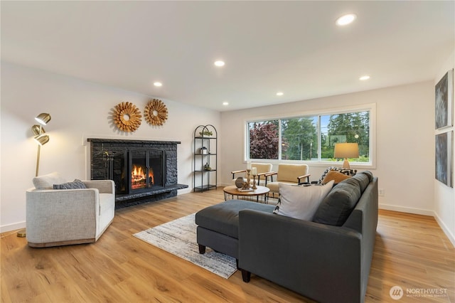 1831 201st Pl SW, Lynnwood, WA 98036 - living room featuring a stone fireplace, recessed lighting, and light wood-type flooring