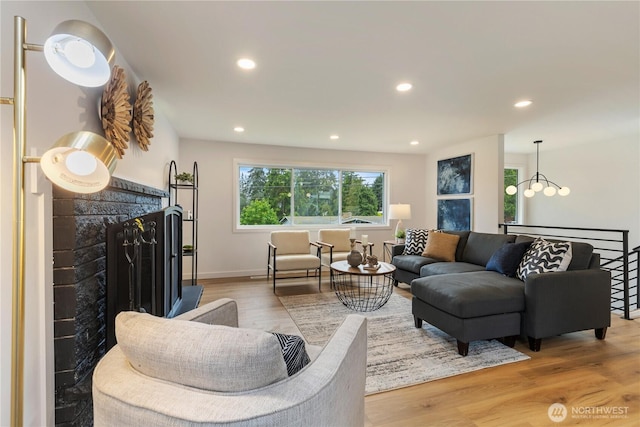 1831 201st Pl SW, Lynnwood, WA 98036 - living room with wood finished floors, a fireplace, recessed lighting, and a chandelier