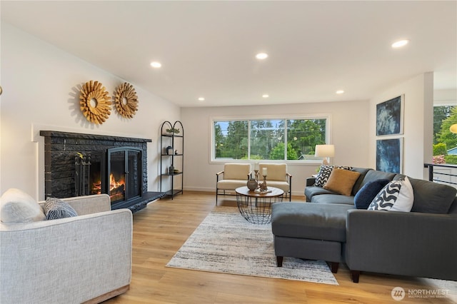 1831 201st Pl SW, Lynnwood, WA 98036 - living area featuring recessed lighting, light wood-style flooring, and a lit fireplace