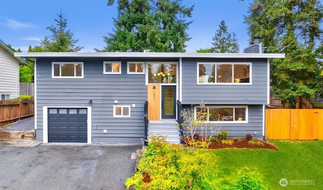 1831 201st Pl SW, Lynnwood, WA 98036 - split foyer home with an attached garage, driveway, and a chimney