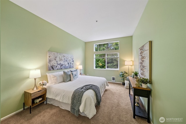 carpeted bedroom featuring baseboards