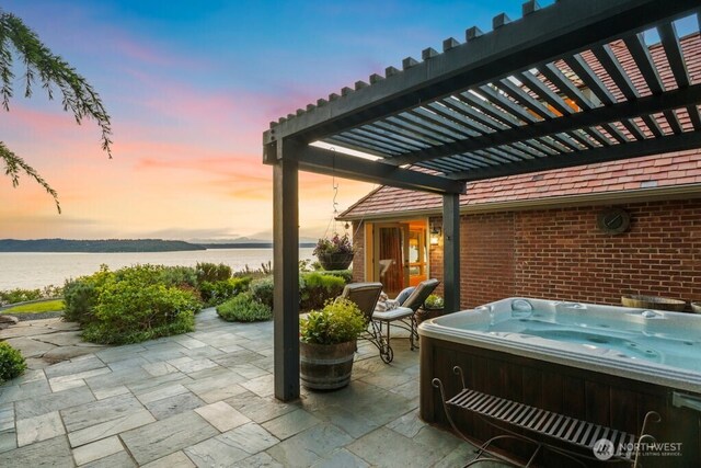 24635 8th Ave S, Des Moines, WA 98198 - view of patio / terrace with a hot tub, a water view, and a pergola