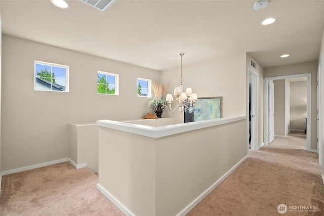 4914 Bering St, Gig Harbor, WA 98332 - hall featuring light colored carpet, a chandelier, recessed lighting, baseboards, and an upstairs landing