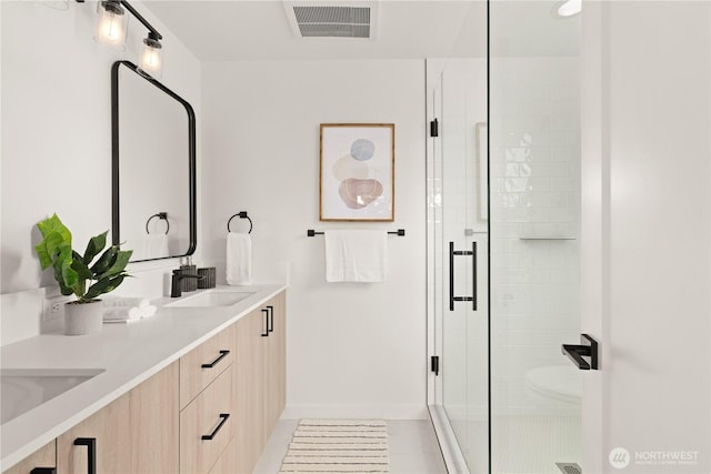 1521 N 39th St, Seattle, WA 98103 - bathroom with double vanity, a shower stall, and baseboards