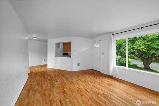 2116 Union Ave SE, Olympia, WA 98501 - unfurnished living room with light wood-type flooring and baseboards