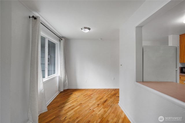 2116 Union Ave SE, Olympia, WA 98501 - spare room featuring light wood-style flooring and baseboards